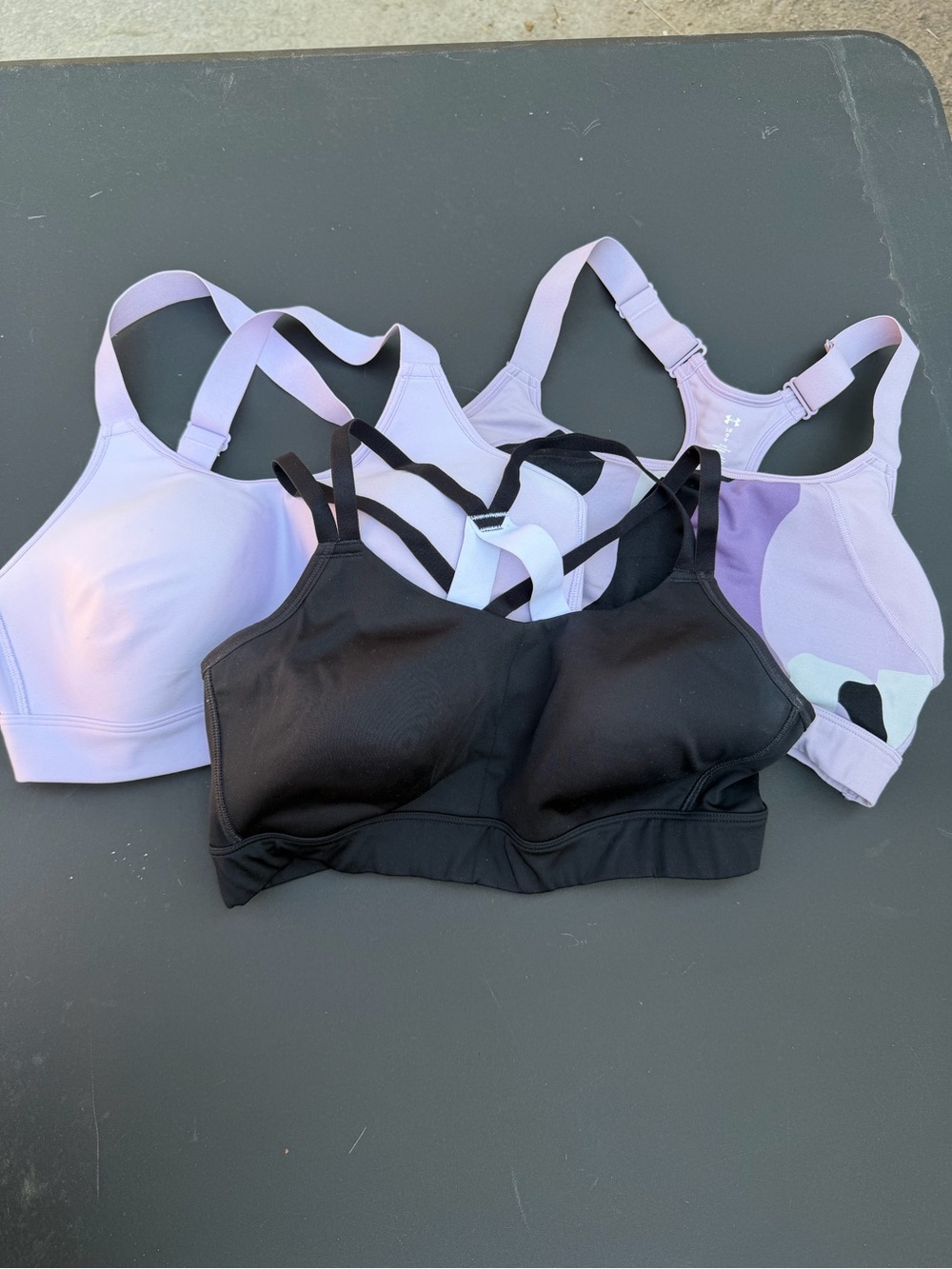 Lot of 3 Under Armour Black and Lavender Sports Bras in near new condition